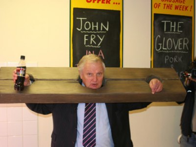 Chairman John Fry in the stocks